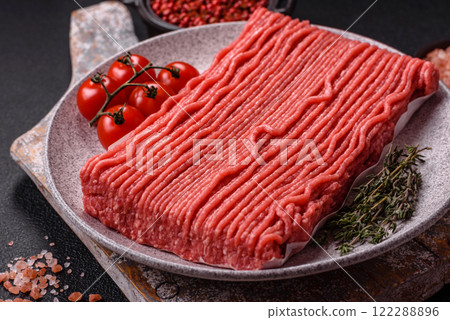 Raw ground beef or pork with salt, spices, herbs and tomatoes Raw ground beef or pork with salt, spices, herbs and tomatoes 122288896