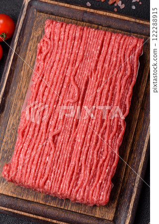 Raw ground beef or pork with salt, spices, herbs and tomatoes Raw ground beef or pork with salt, spices, herbs and tomatoes 122288915