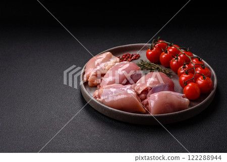 Fresh raw chicken thigh fillets with salt, spices and herbs 122288944