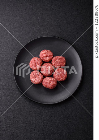 Raw meatballs of minced meat beef, pork or chicken with salt, spices 122289076