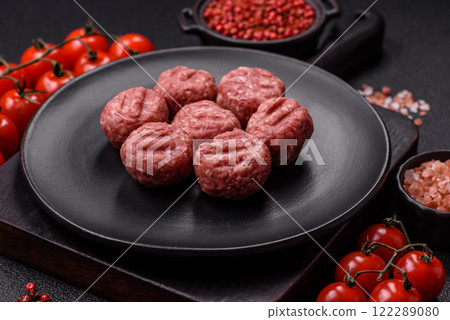 Raw meatballs of minced meat beef, pork or chicken with salt, spices Raw meatballs of minced meat beef, pork or chicken with salt, spices 122289080
