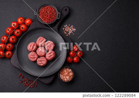 Raw meatballs of minced meat beef, pork or chicken with salt, spices 122289084