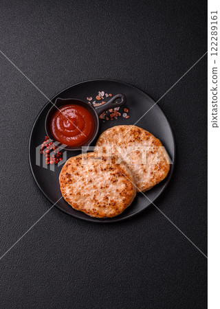 Grilled chicken burger cutlet with salt, spices and herbs 122289161