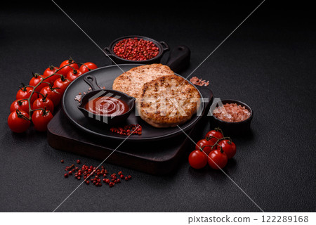 Grilled chicken burger cutlet with salt, spices and herbs Grilled chicken burger cutlet with salt, spices and herbs 122289168