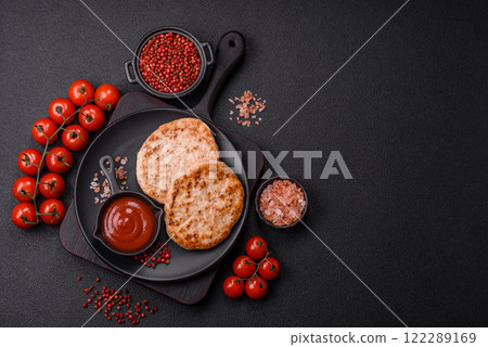 Grilled chicken burger cutlet with salt, spices and herbs 122289169