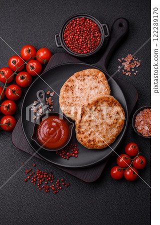 Grilled chicken burger cutlet with salt, spices and herbs 122289170