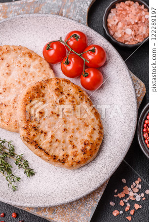Grilled chicken burger cutlet with salt, spices and herbs 122289197
