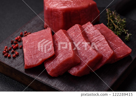 Juicy raw beef cut into slices with salt and spices 122289415