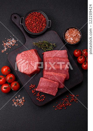 Juicy raw beef cut into slices with salt and spices 122289424