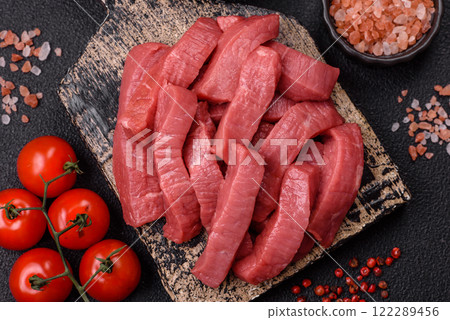 Juicy raw beef cut into slices with salt and spices 122289456