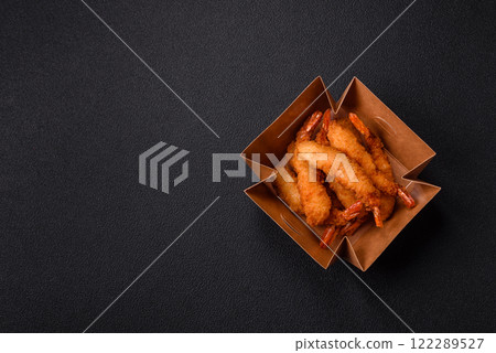 Hot crispy shrimp breaded with salt and spices with white sauce Hot crispy shrimp breaded with salt and spices with white sauce 122289527