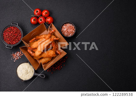 Hot crispy shrimp breaded with salt and spices with white sauce Hot crispy shrimp breaded with salt and spices with white sauce 122289538