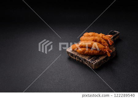 Hot crispy shrimp breaded with salt and spices with white sauce Hot crispy shrimp breaded with salt and spices with white sauce 122289540