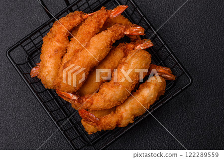 Hot crispy shrimp breaded with salt and spices with white sauce Hot crispy shrimp breaded with salt and spices with white sauce 122289559