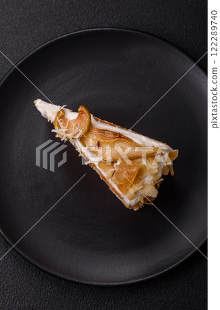 Layered sweet cake with cream, pear and dorblu cheese Layered sweet cake with cream, pear and dorblu cheese 122289740