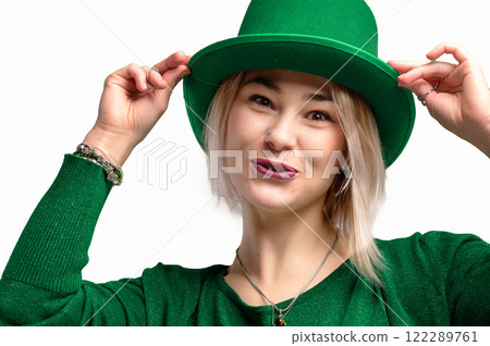 St. Patrick's Day. Beautiful smiling woman wearing green hat 122289761