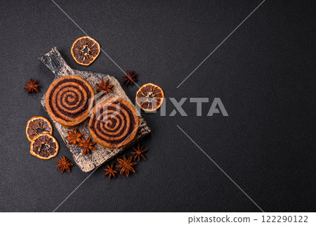 Freshly baked cinnamon roll with spices and cocoa filling Freshly baked cinnamon roll with spices and cocoa filling 122290122