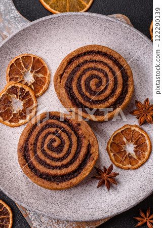 Freshly baked cinnamon roll with spices and cocoa filling 122290139