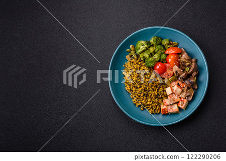 Quinoa bowl with tofu, steamed vegetables, grains, seeds and spices Quinoa bowl with tofu, steamed vegetables, grains, seeds and spices 122290206