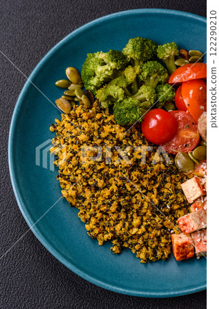 Quinoa bowl with tofu, steamed vegetables, grains, seeds and spices Quinoa bowl with tofu, steamed vegetables, grains, seeds and spices 122290210