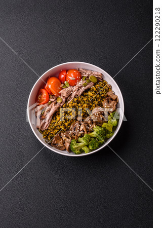 Quinoa bowl with tofu, steamed vegetables, grains, seeds and spices Quinoa bowl with tofu, steamed vegetables, grains, seeds and spices 122290218