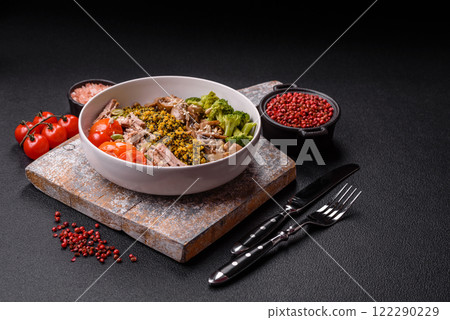 Quinoa bowl with tofu, steamed vegetables, grains, seeds and spices Quinoa bowl with tofu, steamed vegetables, grains, seeds and spices 122290229
