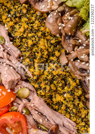 Quinoa bowl with tofu, steamed vegetables, grains, seeds and spices 122290237
