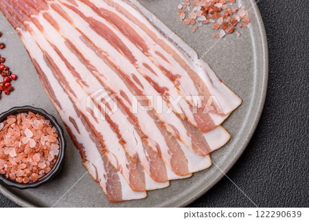 Fresh raw bacon sliced with spices and herbs 122290639