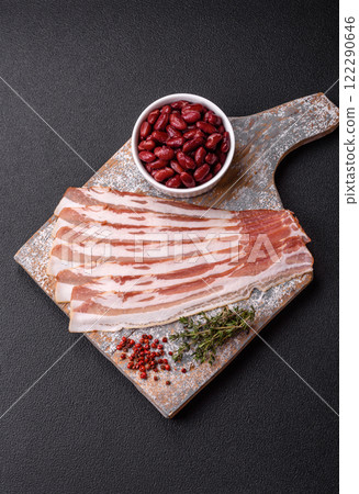 Fresh raw bacon sliced with spices and herbs Fresh raw bacon sliced with spices and herbs 122290646