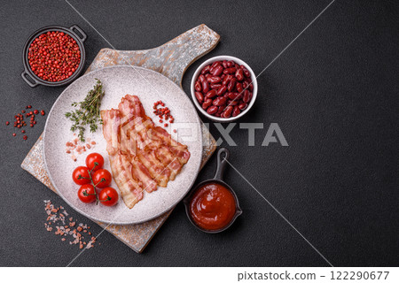 Bacon sliced, grilled with salt and spices 122290677