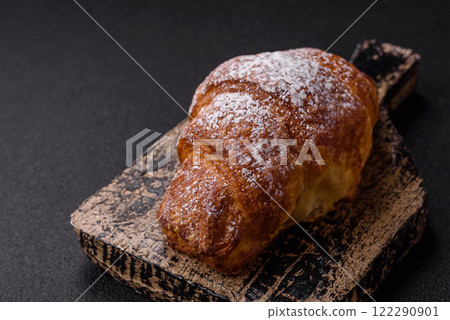 Fresh crispy sweet croissant with chocolate filling 122290901