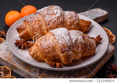 Fresh crispy sweet croissant with chocolate filling 122290924
