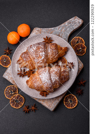 Fresh crispy sweet croissant with chocolate filling 122290929