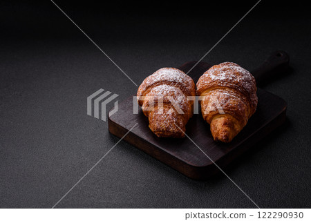 Fresh crispy sweet croissant with chocolate filling Fresh crispy sweet croissant with chocolate filling 122290930
