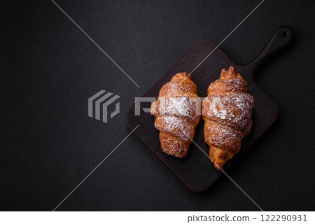 Fresh crispy sweet croissant with chocolate filling Fresh crispy sweet croissant with chocolate filling 122290931