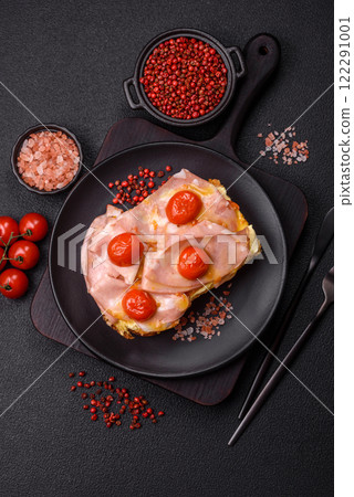 Sandwich with brioche, meat, melted cheese, ham, tomatoes, salt, spices and herbs Sandwich with brioche, meat, melted cheese, ham, tomatoes, salt, spices and herbs 122291001