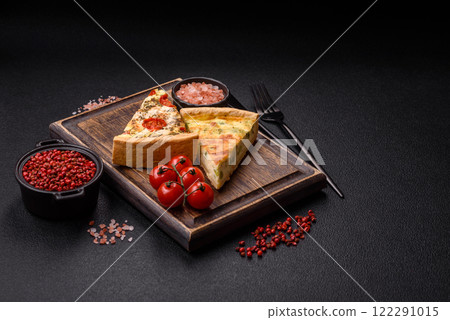 Delicious quiche with broccoli, cheese, chicken, spices and herbs 122291015