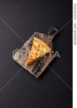 Delicious quiche with broccoli, cheese, chicken, spices and herbs 122291032