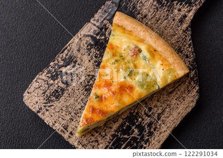 Delicious quiche with broccoli, cheese, chicken, spices and herbs Delicious quiche with broccoli, cheese, chicken, spices and herbs 122291034