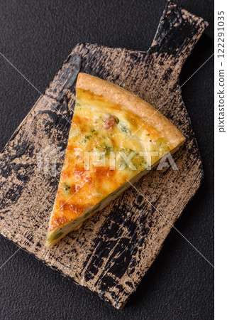 Delicious quiche with broccoli, cheese, chicken, spices and herbs Delicious quiche with broccoli, cheese, chicken, spices and herbs 122291035
