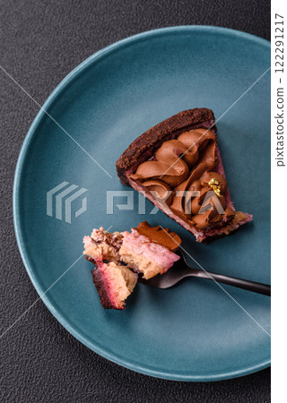 A piece of sweet cheesecake with mascarpone cheese, strawberry flavor 122291217