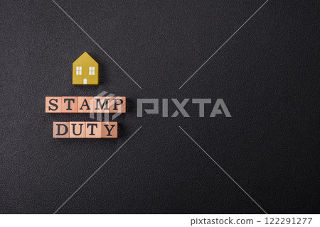 The inscription Stamp Duty made of wooden cubes on a plain background 122291277