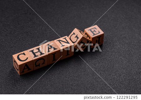The inscription chance or change with wooden cubes on a dark concrete background The inscription chance or change with wooden cubes on a dark concrete background 122291295