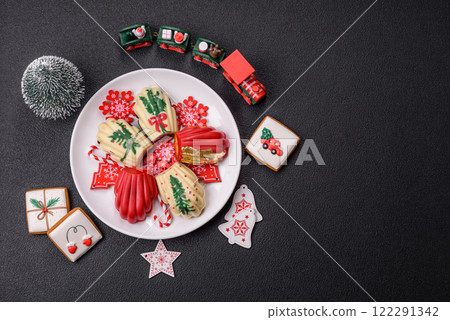 Sweet Madeleines desserts covered with chocolate in Christmas colors 122291342