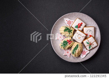 Sweet Madeleines desserts covered with chocolate in Christmas colors Sweet Madeleines desserts covered with chocolate in Christmas colors 122291345