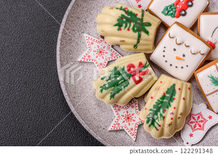 Sweet Madeleines desserts covered with chocolate in Christmas colors 122291348