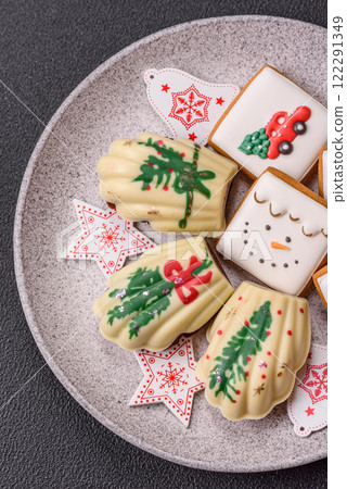 Sweet Madeleines desserts covered with chocolate in Christmas colors 122291349