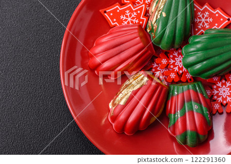 Sweet Madeleines desserts covered with chocolate in Christmas colors Sweet Madeleines desserts covered with chocolate in Christmas colors 122291360
