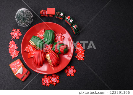 Sweet Madeleines desserts covered with chocolate in Christmas colors Sweet Madeleines desserts covered with chocolate in Christmas colors 122291366