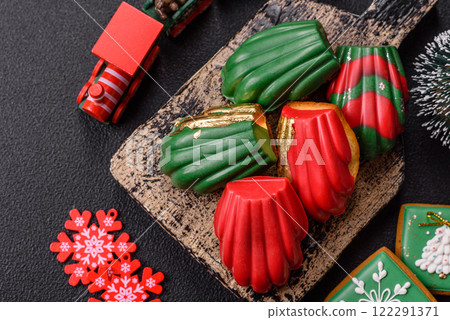 Sweet Madeleines desserts covered with chocolate in Christmas colors Sweet Madeleines desserts covered with chocolate in Christmas colors 122291371